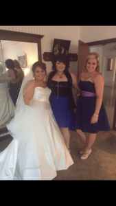 two women in dresses standing next to each other