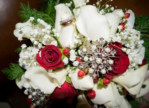 a bridal bouquet with red roses and white flowers
