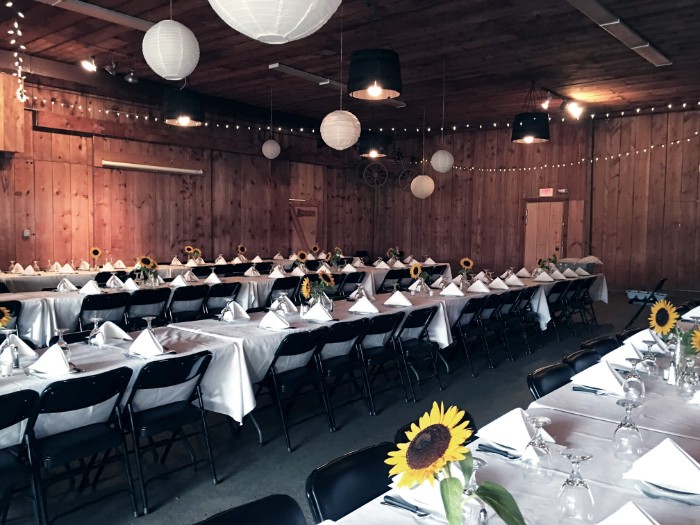 a banquet hall with tables and chairs set up for a formal function