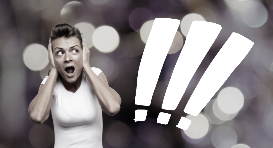 a woman holding her head in front of a question mark