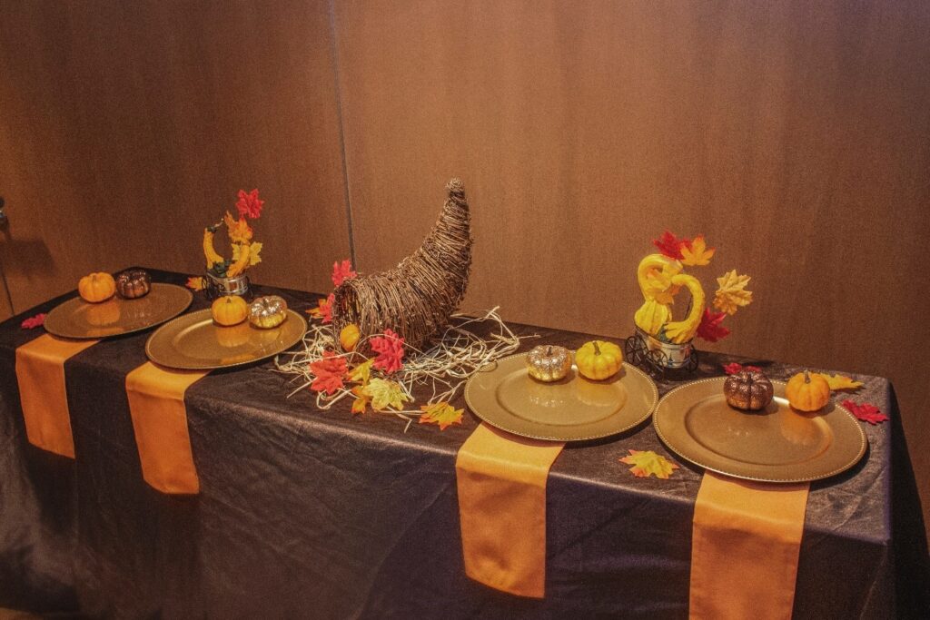 a table set up with plates and place settings