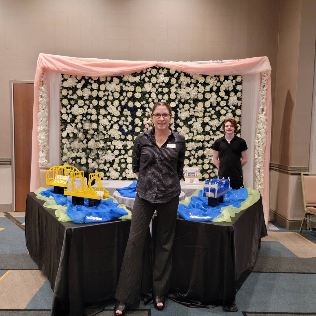 two women standing in front of a table with legos on it